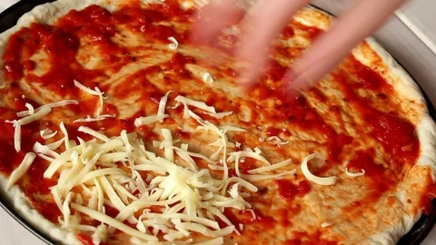 Making pizza, putting cheese on Video stock 72458882