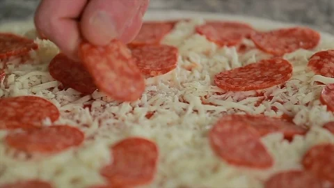 Making pizza, putting salami, pepperoni Stock Footage 73000608