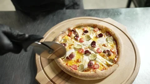 Making Pizza in Restaurant Kitchen Stock Footage 328952751