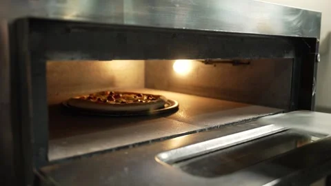Making Pizza in Restaurant Kitchen Stock Footage 328952757