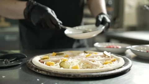 Making Pizza in Restaurant Kitchen Stock Footage 328952762