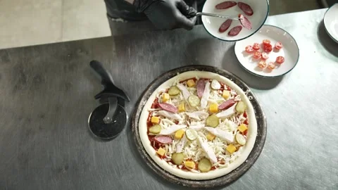 Making Pizza in Restaurant Kitchen Stock Footage 328952763