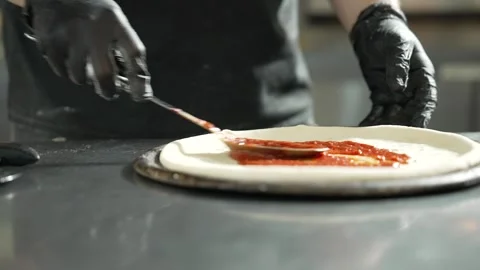 Making Pizza in Restaurant Kitchen Stock Footage 328952784