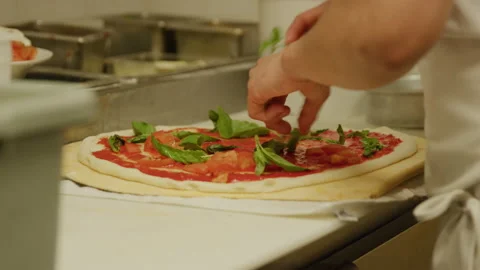 Making pizza tomato spinach on pizza italian restaurant kitchen Stock Footage 238961263