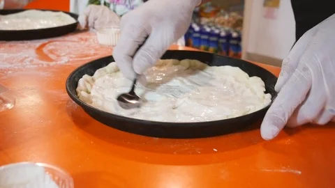 Making pizza in a vessel Stock Footage 111566730