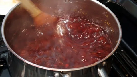 Making plum jam in large metal pot. Stock Footage 111692973