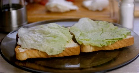 Making poached egg toast with salad and tomato closeup Stock Footage 87251865