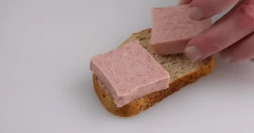 Making a pressed pork canned meat sandwich on wheat bread. Stock Footage 86161871
