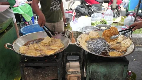 The Making Process of Tempe Mendoan Being Fried in Hot Cooking Oil Stock Footage 340468957