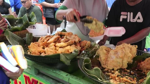 The Making Process of Tempe Mendoan Being Fried in Hot Cooking Oil Stock Footage 340469030