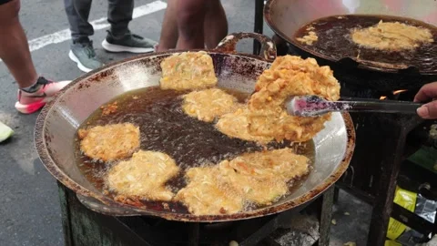 The Making Process of Tempe Mendoan Being Fried in Hot Cooking Oil Stock Footage 340469408