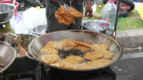 The Making Process of Tempe Mendoan Being Fried in Hot Cooking Oil Stock Footage 340469482