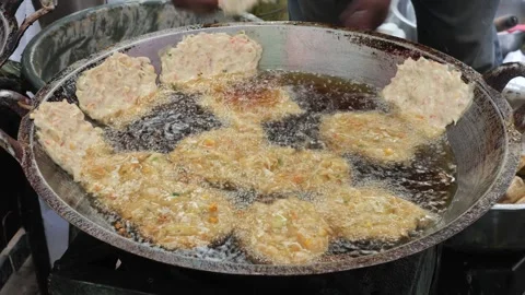 The Making Process of Tempe Mendoan Being Fried in Hot Cooking Oil 스톡 동영상 340469518