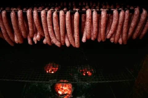 Making process of thai tradition pork sausage in charcoal oven Stock-Fotos