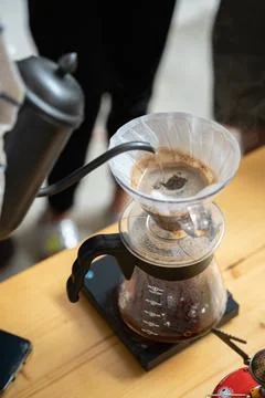 Making process of V60 coffee, filter coffee, pouring hot water on the coffee 写真素材