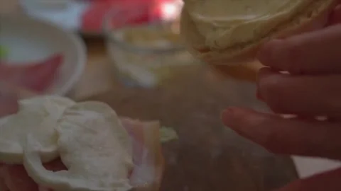 Making a prosciutto ham and mozzarella cheese panini sandwich Stock Footage 262911290