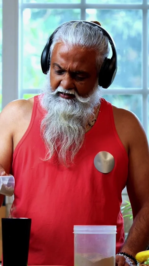 Making protein shake post workout, Indian mid age fit man in kitchen Stock Footage 342756929