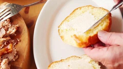 Making pulled chicken sandwich Stock Footage 77173554