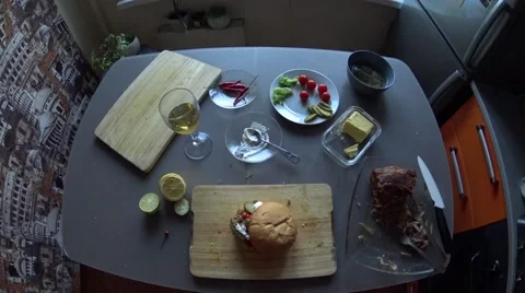 Making pulled pork burger on kitchen: cover it with bun on wooden board Stock Footage 64662413