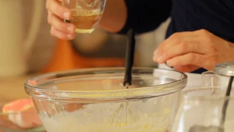 Making Pumpkin Pancakes on Frying Pan. Homemade Griddle Cakes add oil  Stock Footage 74766760