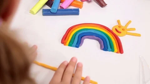 Making a rainbow from plasticine Video stock 70469206