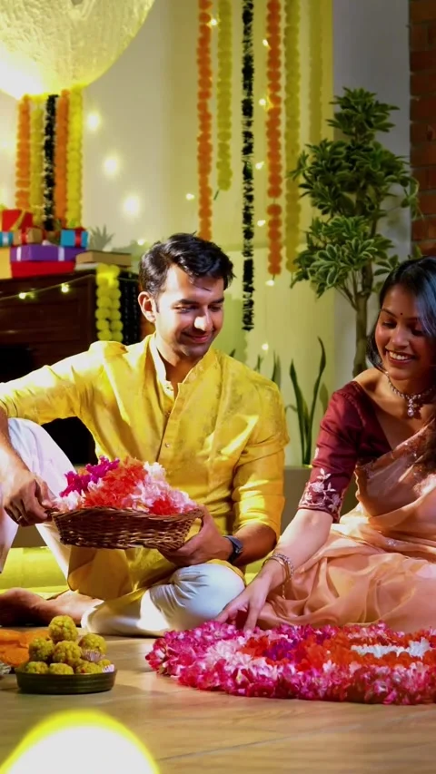 Making rangoli with flower, Indian couple decorates home joyfully on Diwali Stock Footage 342382196