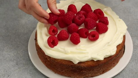 Making raspberry cake with frosting and fresh berries, recipe process video Stock Footage 242605513