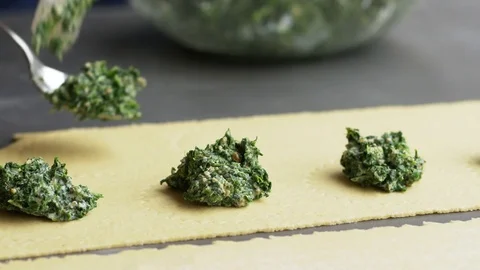 Making ravioli with a spinach walnut filling Stock Footage 71238058