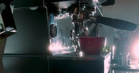 Making in red mug of strong coffee in a coffee machine, the back light Stock Footage 236499472