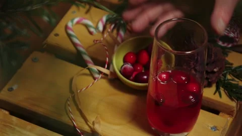Making red ripe cranberry drink Stock Footage 325448346