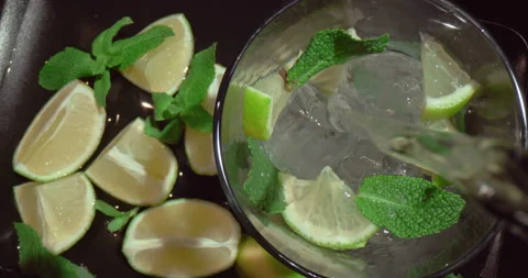 Making a refreshing summer drink mojito or lemonade. Stock Footage 157312011