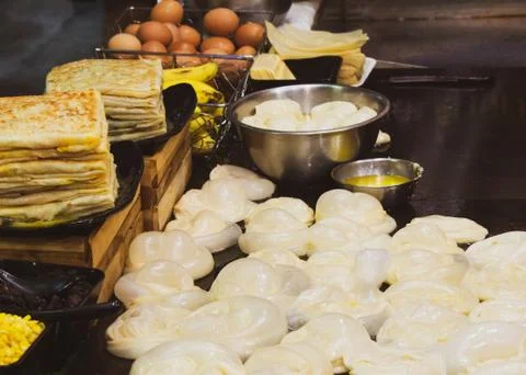 Making of Roti Canai, cooking process, Indian traditional street food Stock Photos