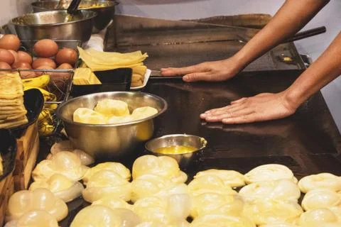 Making of Roti Canai, cooking process, Indian traditional street food Stock Photos