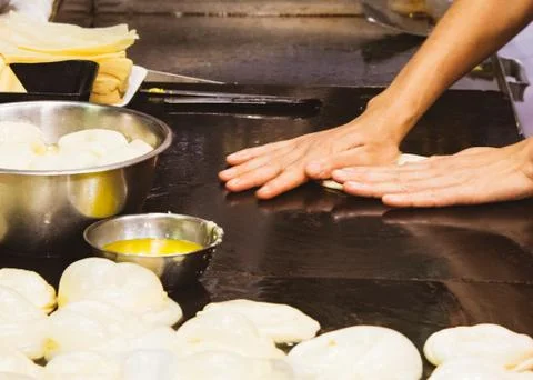 Making of Roti Canai, cooking process, Indian traditional street food Stock Photos