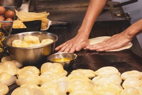 Making of Roti Canai, cooking process, Indian traditional street food Stock Photos