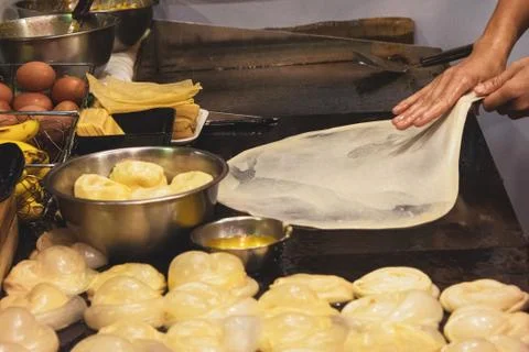 Making of Roti Canai, cooking process, Indian traditional street food Stock Photos