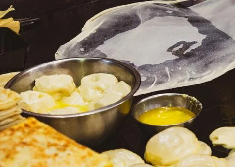 Making of Roti Canai, cooking process, Indian traditional street food Stock Photos