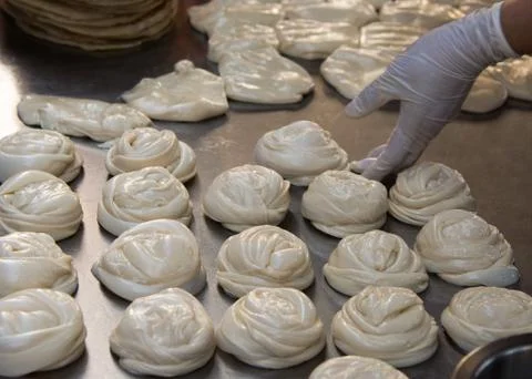 Making of Roti Canai, cooking process, Indian traditional street food Stock Photos