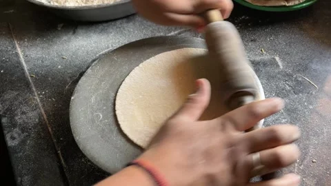 Making Roti on Chakla with Rolling Pin | Indian Woman Hands Rolling Dough Stockbeeldmateriaal 318973113