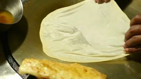 Making Roti a fried bread sheet, Thailand Street Food Stock Footage 77009879