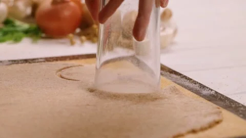  Making round blanks for dumplings from the dough in slow motion Stock Footage 149499619