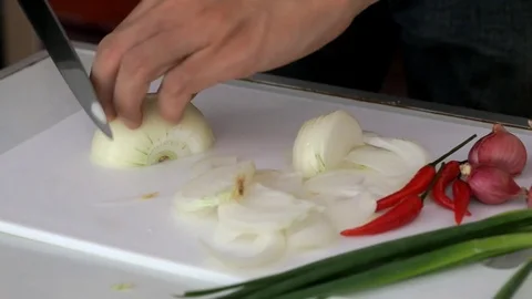 Making salad by slice onion Stock Footage 74008624