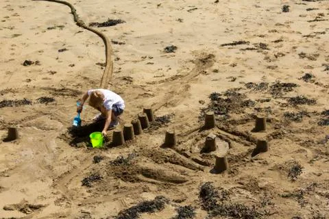 Making sandcastles Stock Photos
