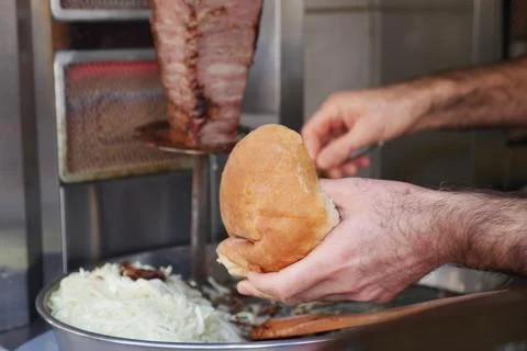 Making a sandwich with meat and bread at street food stand Stock Photos