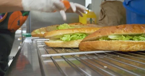 Making sandwich preparing snack fresh vegetables meat healthy fast food meal 4k Video stock 83884118