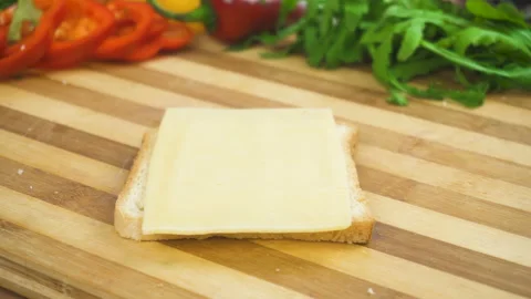 Making sandwich with white bread, ham, salad, tomatoes Stock Footage 87825976