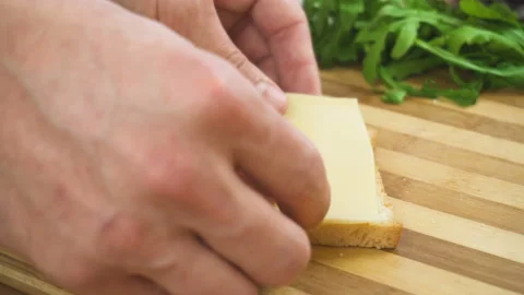 Making sandwich with white bread, ham, salad, tomatoes Stock Footage 88052648