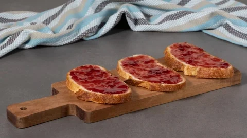 Making sandwiches with bread and strawberry jam. Stop motion animation Stock Footage 287689472