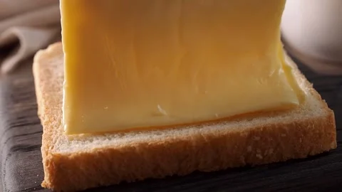 Making sandwiches from toast bread and melted cheese. Video stock 244773636