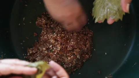 Making Sarmale - Stuffed Vine Leaf Rolls Stock Footage 135682075